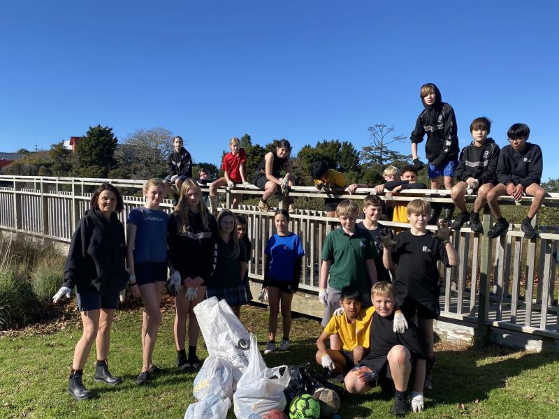 Group of school children joining clean up 